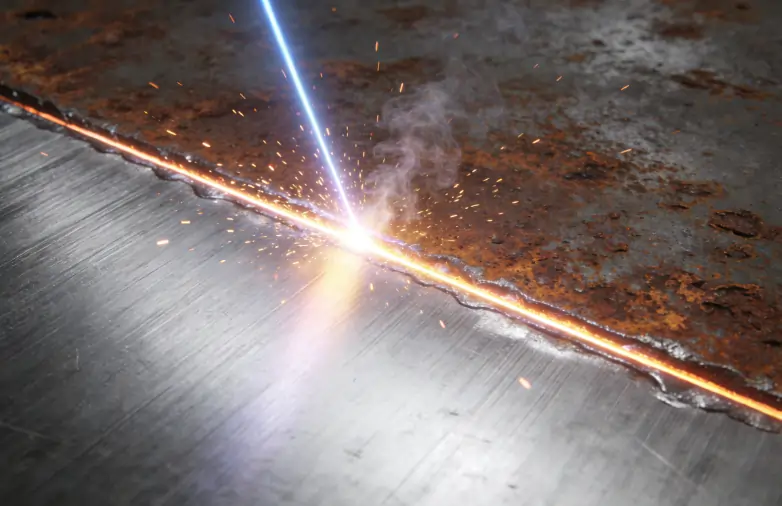 A visual representation of the laser ablation threshold safely removing rust without damaging the base metal.